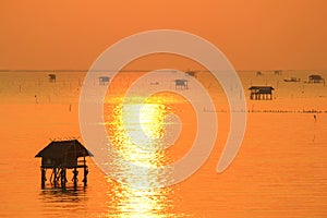 Silhouette view at sunrise time of bamboo cottage at Bang Tabun, Phetchaburi, Thailand