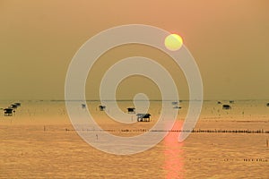 Silhouette view at sunrise time of bamboo cottage at Bang Tabun, Phetchaburi, Thailand