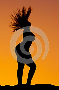 Silhouette of voluptuous woman standing