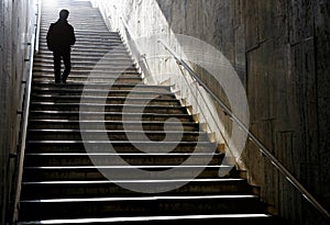 Silhouette walking down the stairs