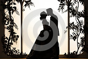 silhouette of wedding Couple in love kissing and holding hand together during sunset with evening sky background