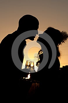 Silhouette of wedding couple at sunset