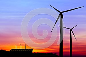 silhouette wind turbine generator with factory emissions of carbon dioxide