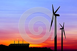 silhouette wind turbine generator with factory emissions of carbon dioxide