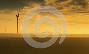 Silhouette of a windmill captured at sunrise , France