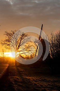 Silhouette of windmill at early sunrise, De Rietveldse Molen, Hazerswoude Dorp