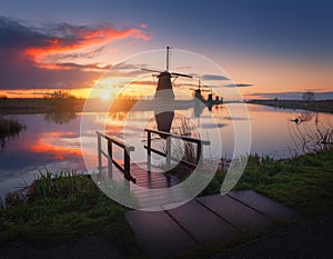 Silhouette of windmills at sunrise in Kinderdijk, Netherlands