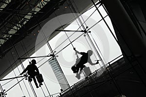 Silhouette of Window Cleaners