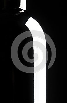 Silhouette of wine bottle, black background photo