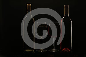 Silhouette of wine bottles and glasses