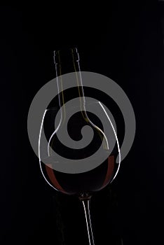 Silhouette of wine glass and bottle