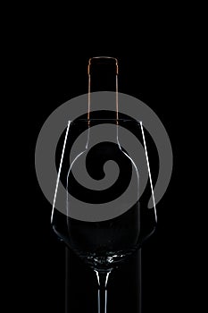 silhouette of wine glass and bottle in black background