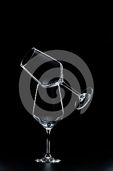 silhouette of wine glasses on black background