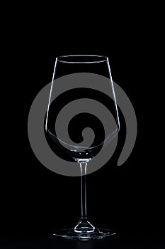 silhouette of wine glasses on black background