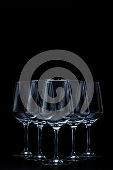 silhouette of wine glasses on black background