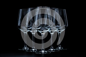 silhouette of wine glasses on black background