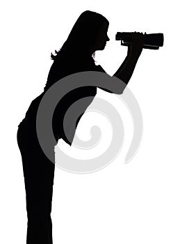 Silhouette of woman with binoculars photo