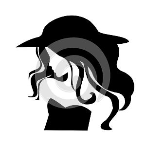 Silhouette of a woman in a black hat