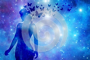 Silhouette of a woman with blue butterflies over starry background