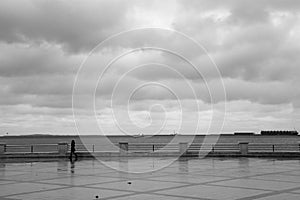 Silhouette of woman on the Bulvar on the Caspian Sea, in Baku, capital of Azerbaijan