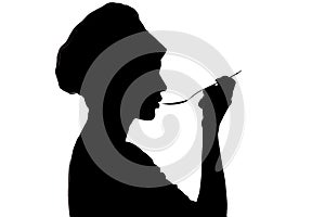 Silhouette of woman cooking in a cap, profile of a girl blowing at soup on spoon on a white isolated background