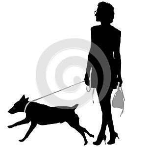 Silhouette of woman and dog on a white background