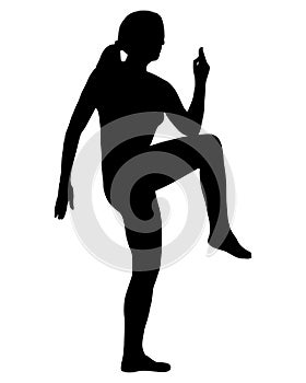 Silhouette of woman doing exercises