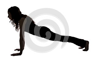 Silhouette of a woman doing Plank Pose in Yoga