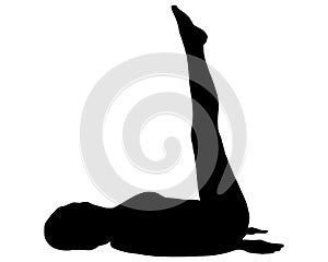 Silhouette of woman doing yoga