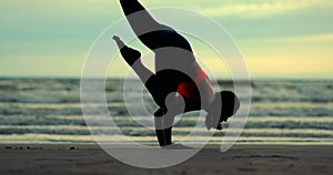 Silhouette woman doing yoga pose on mat outdoor stretching relaxation exercise fitness sport for healthy