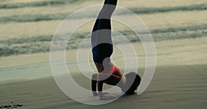 Silhouette woman doing yoga pose on mat outdoor stretching relaxation exercise fitness sport for healthy