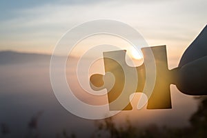 Silhouette Woman hands connecting couple puzzle piece against sunrise, Business solutions, target, success, goals and strategy
