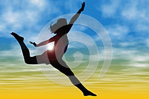 Silhouette Of Woman Jumping Against Sky