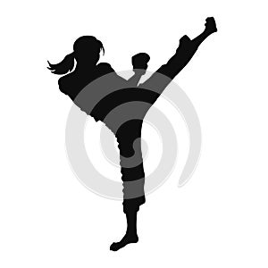 silhouette of a woman kickboxing athlete in action pose.