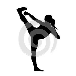 silhouette of a woman kickboxing athlete in action pose.