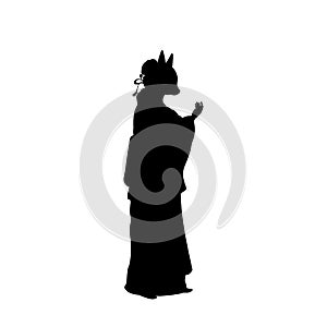 Silhouette of woman in Kitsune mask.