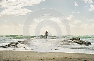 Silhouette of woman looking at stormy Mediterranean sea, Alanya, Turkey