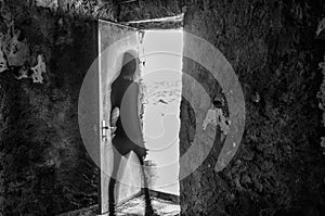 silhouette of a woman with motion blur in a ruin