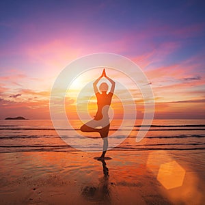 Silhouette of a woman practicing yoga in the rays of the surrealist sunset at the seaside.