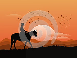 Silhouette of a woman riding a horse on top of a mountain with sunset  background