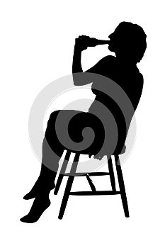 Silhouette of a woman sitting on a chair