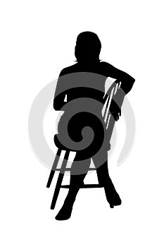 Silhouette of a woman sitting on a chair