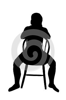 Silhouette of a woman sitting on a chair