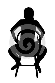 Silhouette of a woman sitting on a chair