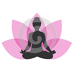 Silhouette of a woman sitting in lotus position on lotus flower background. Girl doing yoga and meditating. Meditation and healthy