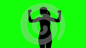 Silhouette of woman stretching arms on green screen