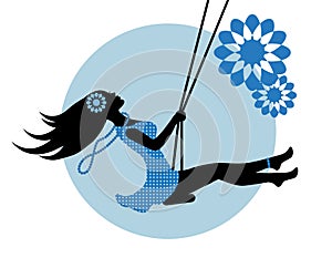 Silhouette of a woman on a swing