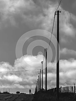 silhouette of the woman walking on the coutry road