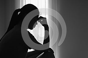 Silhouette of woman who stressed severely, depression or domestic violence. The concept of sexual harassment against women and