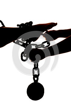 Silhouette womans legs ball and chain with hands